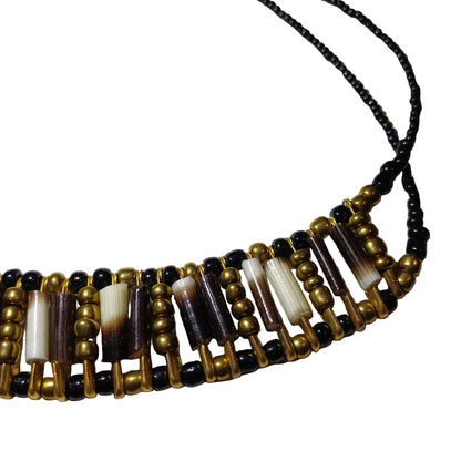 Old gold beaded porcupine quill necklace detail showing natural quill patterns